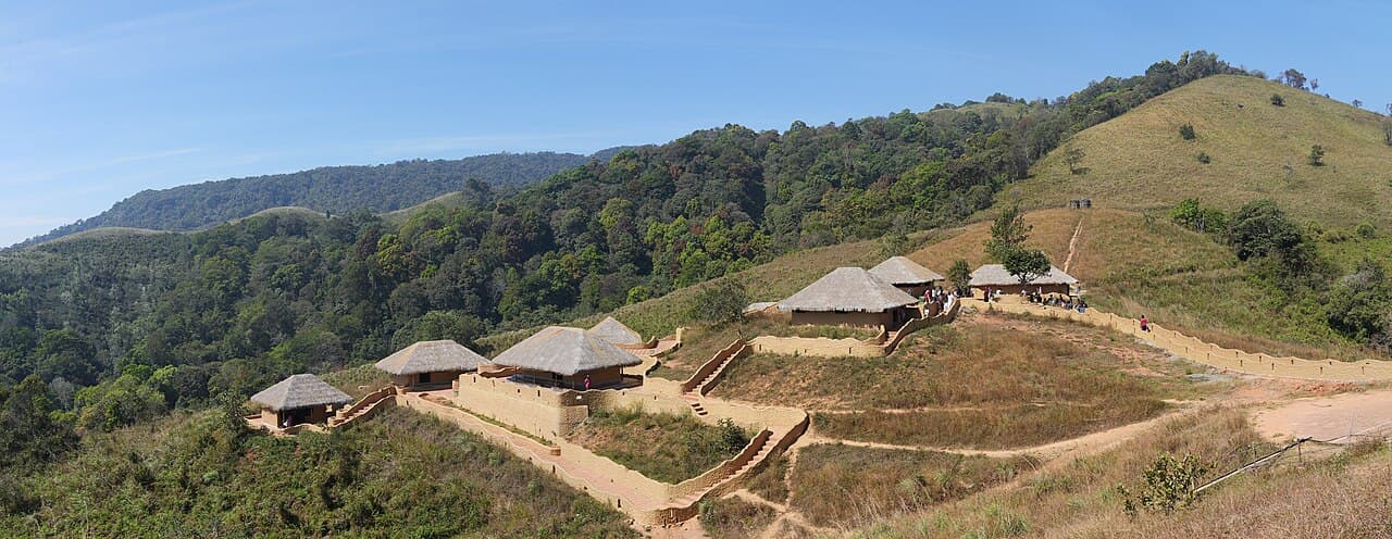 En Ooru heritage village buildings across a Wayanad hillside